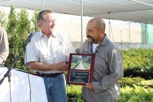 Thomas receiving award for best residential landscape maintenance
