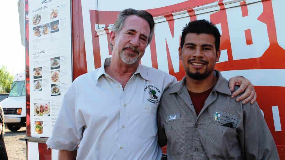 MarkandIsmaelhangingoutinfrontofthefoodtruckattheCLCAawardceremony