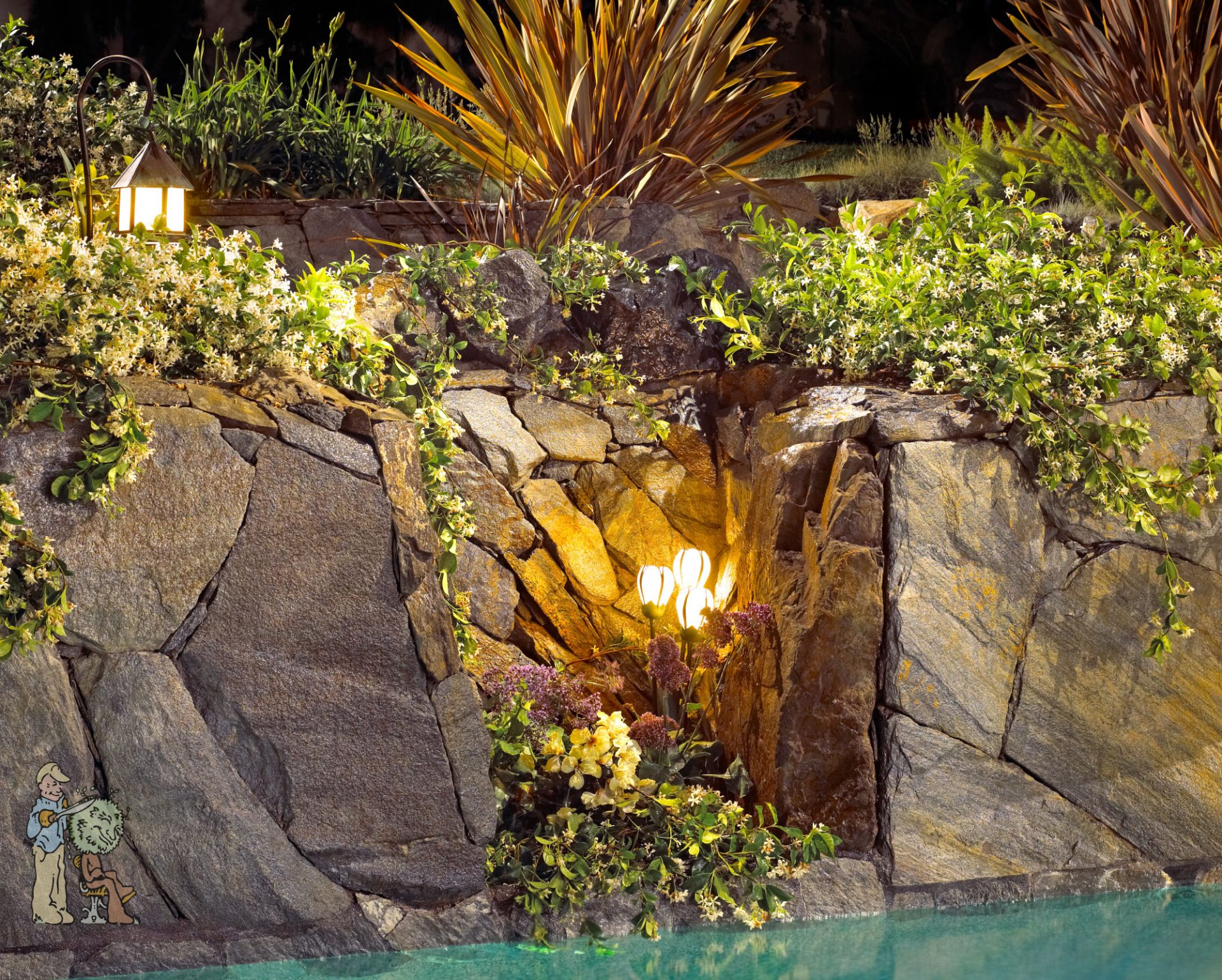 Detail of real boulder cove with low voltage lighting built into swimming pool